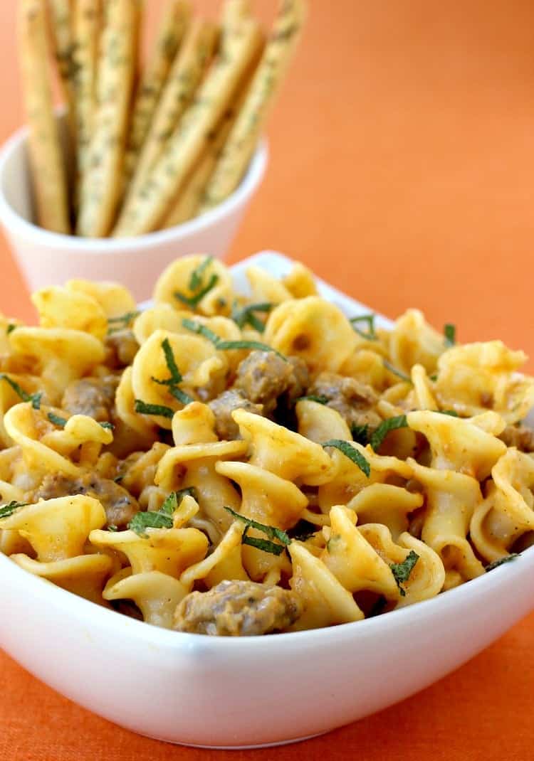 Pasta with Pumpkin Cream Sauce is my kind of fall comfort food! Pasta swimming in a creamy, pumpkin sauce with sausage and fresh herbs! pasta-pumpkin-cream-sauce