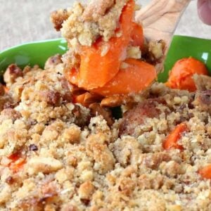 oven roasted carrots with a streusel topping in a green dish