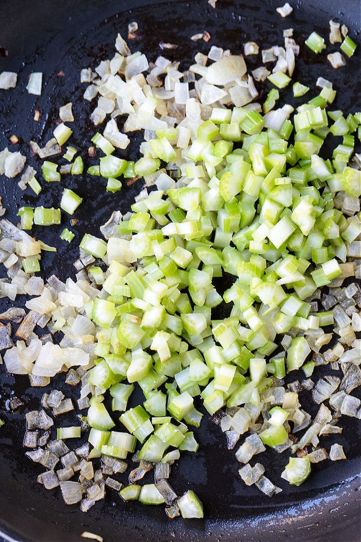 diced celery and onions in a skillet