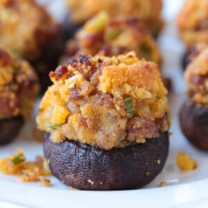stuffed mushroom with sausage and cornbread on a plate