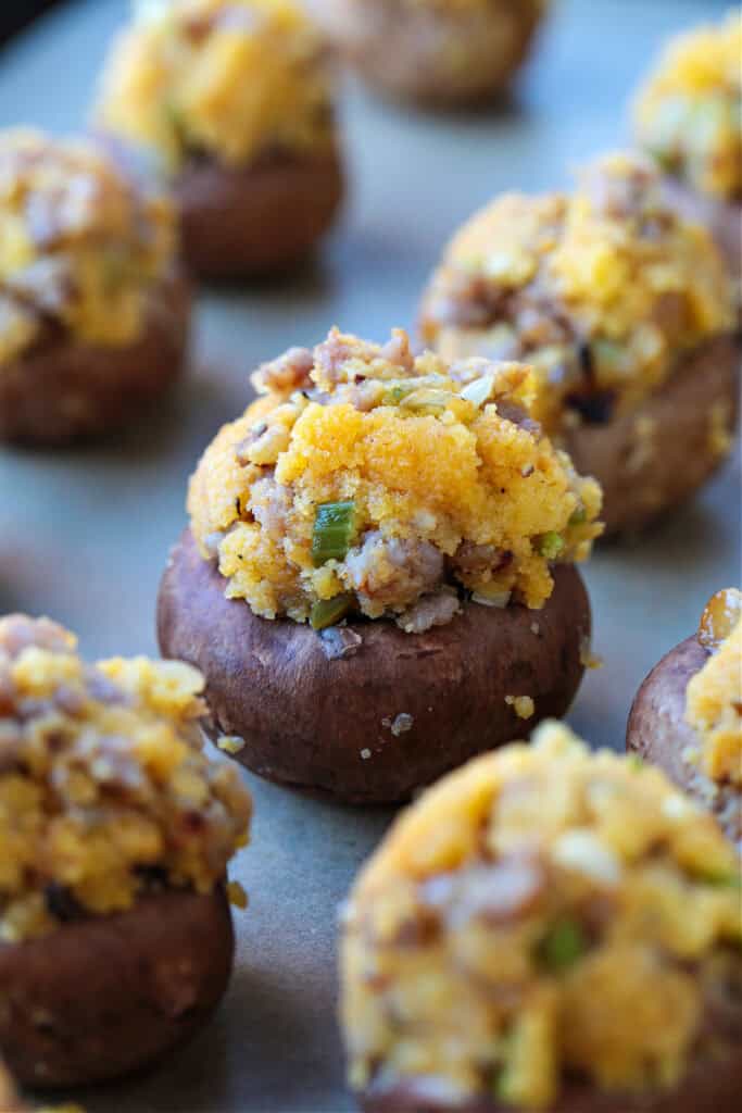 stuffed mushrooms on a baking sheet