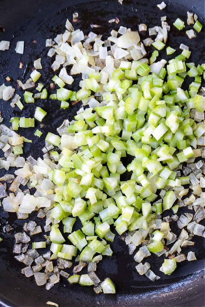 diced celery and onion in a skillet
