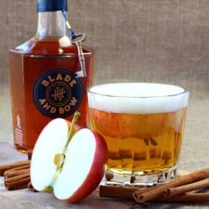 bourbon cocktail with apple garnish