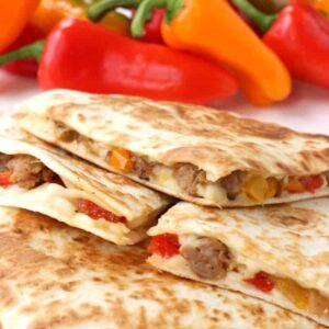 Sausage and Pepper Quesadillas stacked on a plate