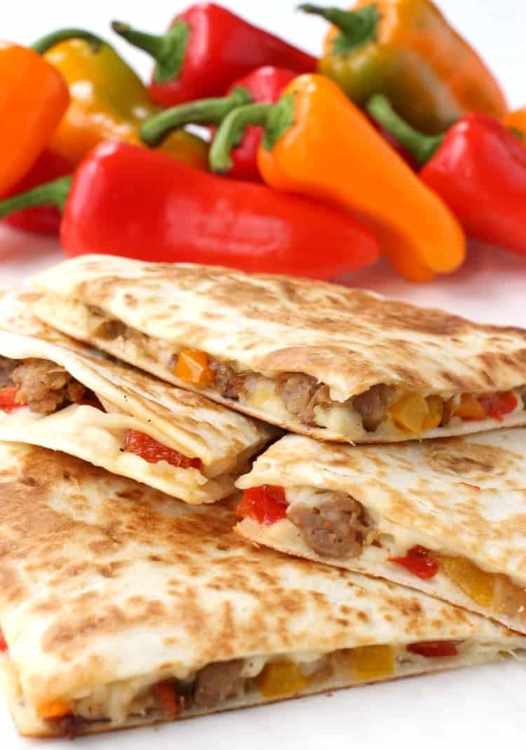 Sausage and Pepper Quesadillas stacked on a plate