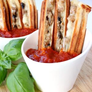 pizza sticks in cups with marinara sauce