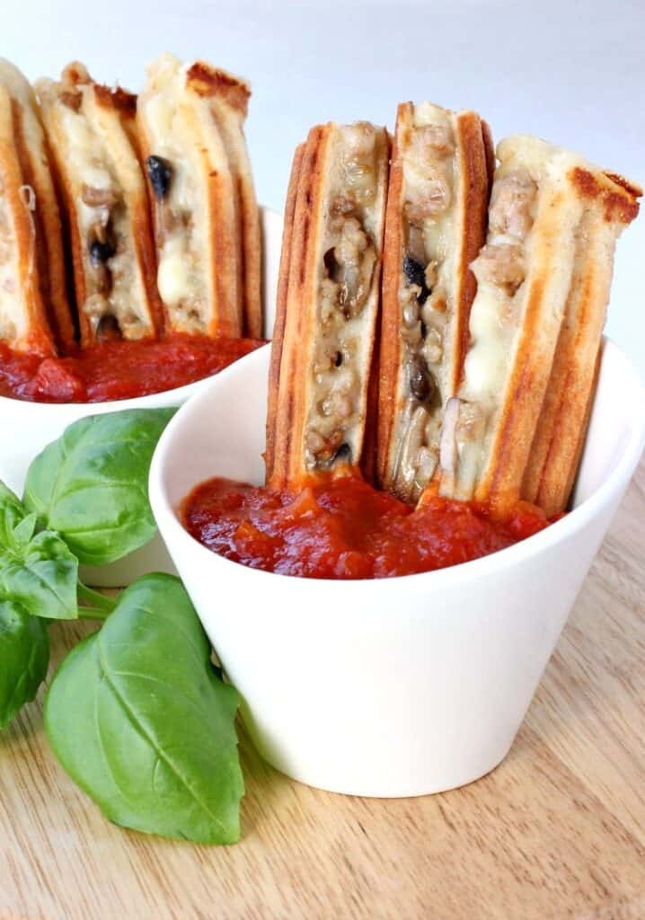 Panini Pizza Sticks are a fun twist on pizza night! Add your favorite pizza toppings or have a pizza toppings bar to customize your own! panini-pizza-sticks-feature