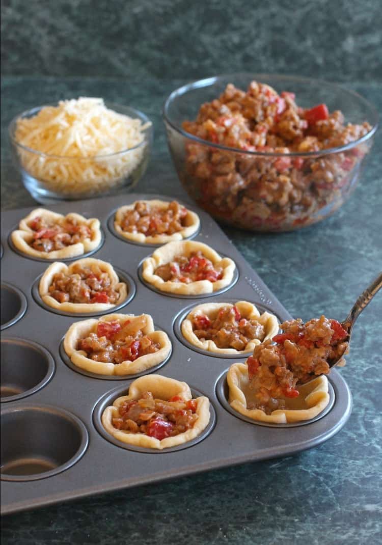 Sausage and Pepper Crescent Cups are filled with sausage and peppers and topped with cheese