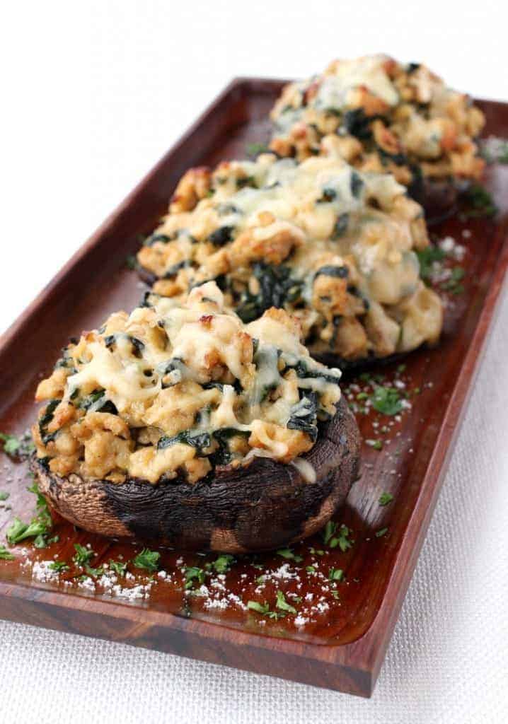 Stuffed mushrooms on a wooden palte