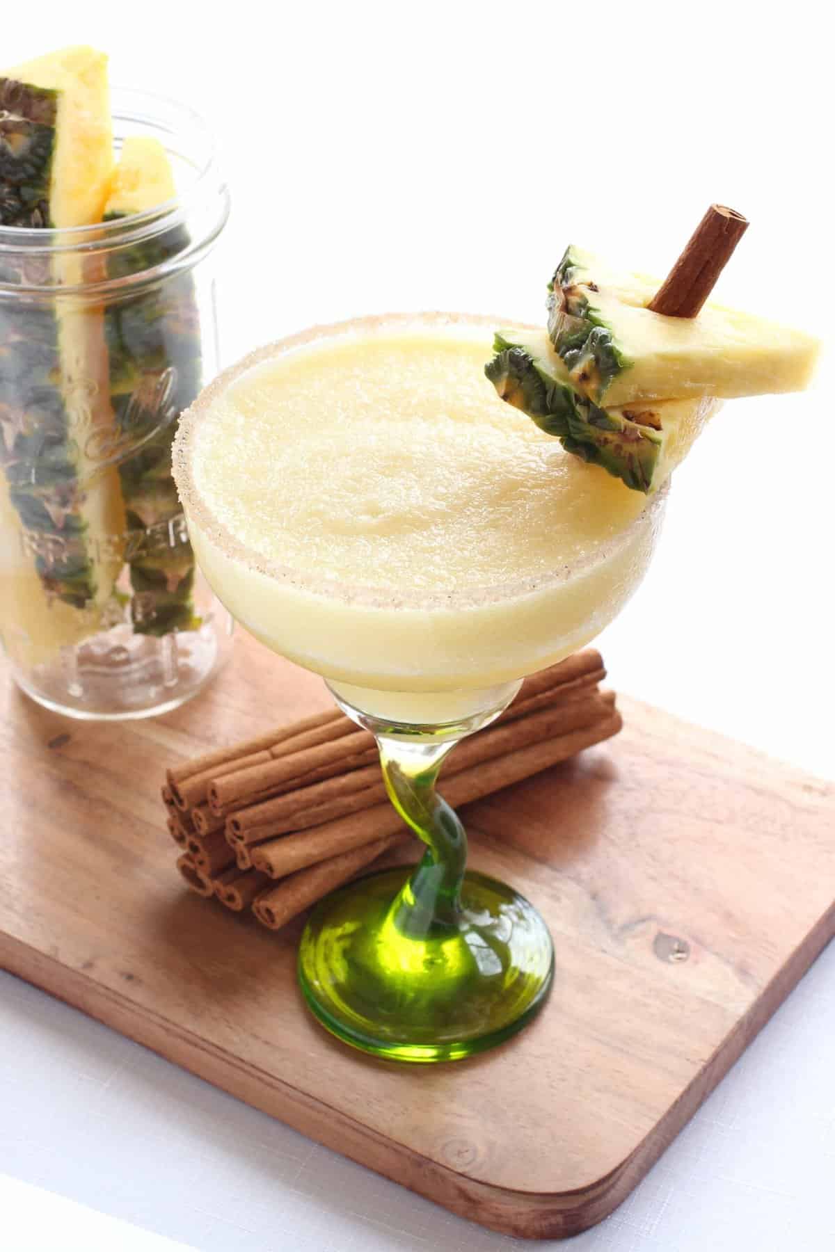 This frozen Cinnamon Pineapple Margarita is bursting with pineapple flavor and warm cinnamon touch. It's a delicious, all season cocktail! Cinnamon Pineapple Margarita Recipe