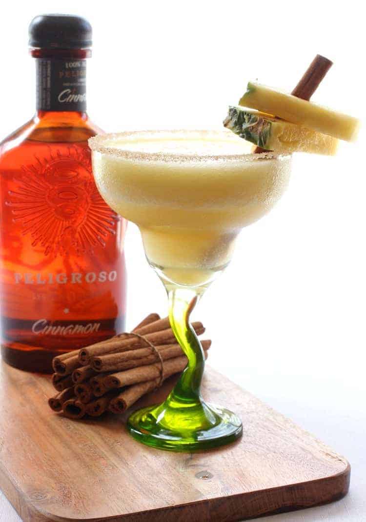 This frozen Cinnamon Pineapple Margarita is bursting with pineapple flavor and warm cinnamon touch. It's a delicious, all season cocktail! Pineapple Margarita Cocktail Recipe