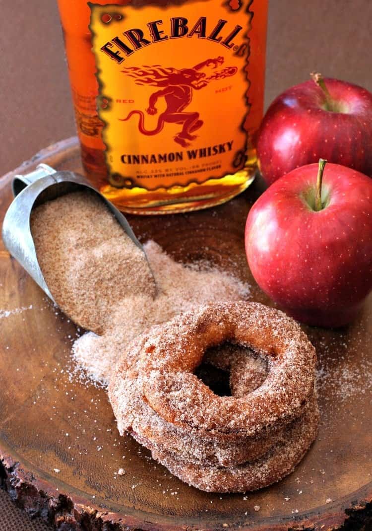 Fireball Apple Fritters are the ultimate party dessert! Fresh apple fritters coated in a cinnamon whiskey batter tossed with cinnamon sugar. fireball-apple-fritters-top