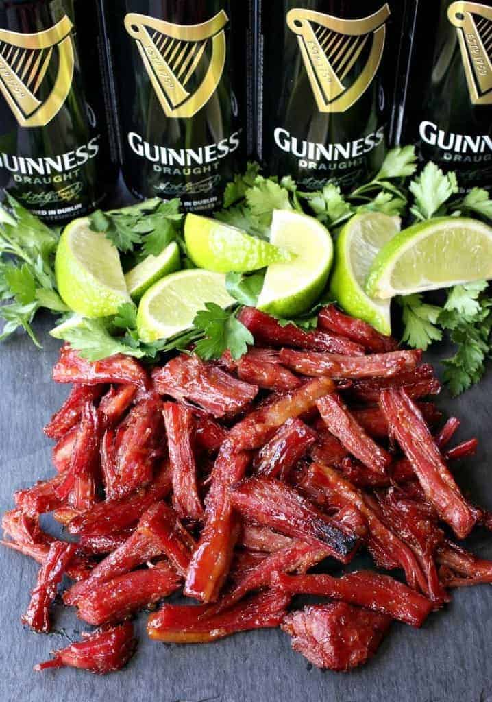 Shredded corned beef with limes and Guinness beer cans