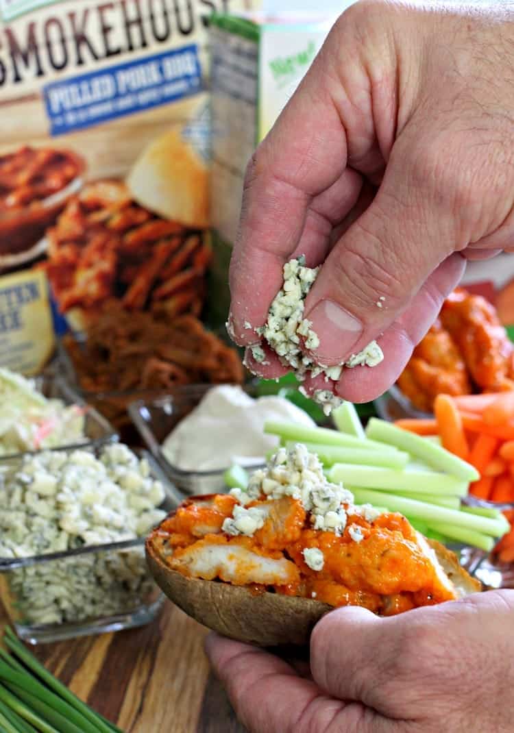 This Potato Skin Bar is a fun party idea for game days! Set out all the toppings and let your guests customize their own potato skins! stuffed-potato-skin-bar-topping