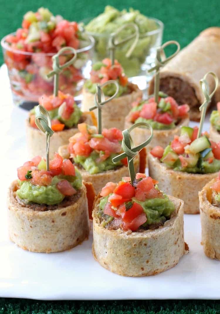 Tex-Mex Sausage Tortilla Rolls will be gone in seconds at your next party! A cheesy sausage roll filling wrapped in a crispy tortilla shell! tex-mex-sausage-tortilla-roll-featured