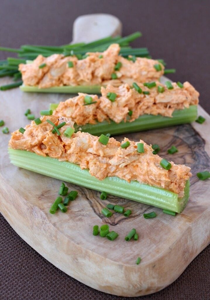 Buffalo Chicken on top of celery sticks with chives