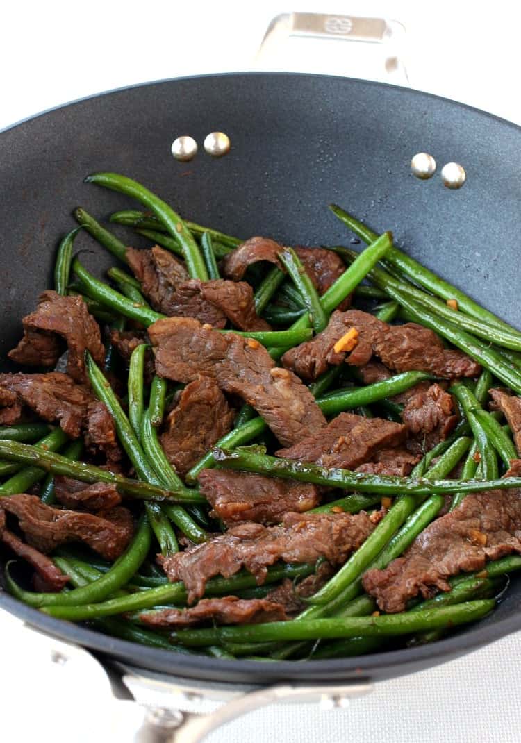 Ginger Beef and Green Bean Stir Fry is an authentic tasting meal that's way better than take out! A dinner recipe that everyone will love! Ginger Beef and Green Bean Stir Fry is a stir fry recipe that is a low carb dinner