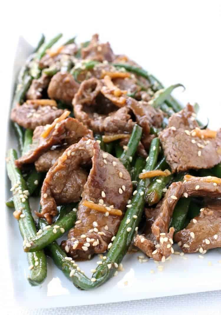 Ginger Beef and green bean stir fry on a white plate