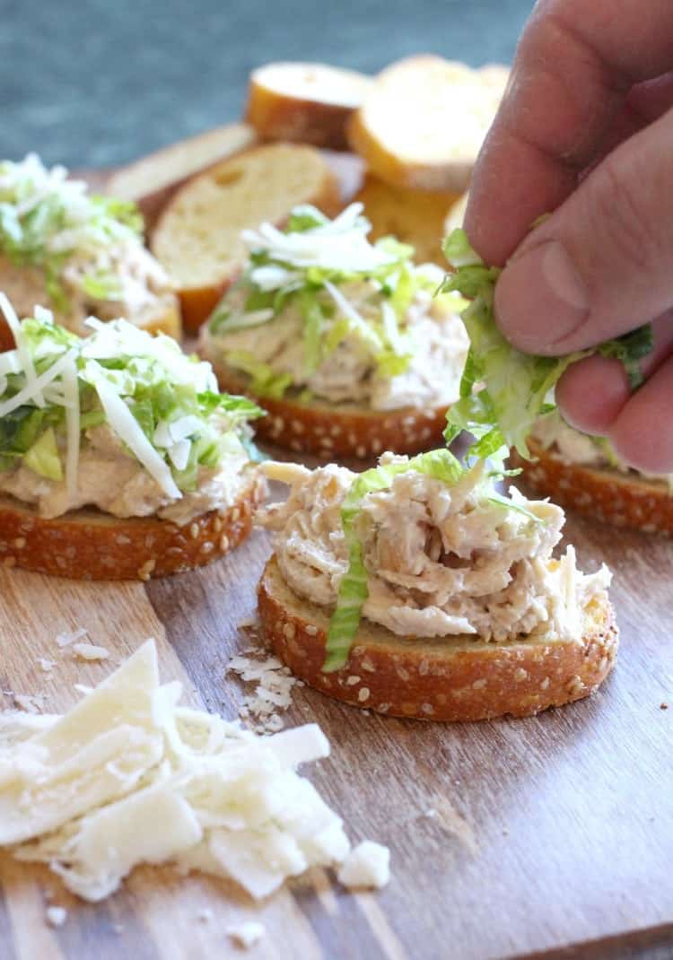 Caesar Chicken Salad Bruschetta is a chicken salad recipe that's topped with lettuce and parmesan cheese