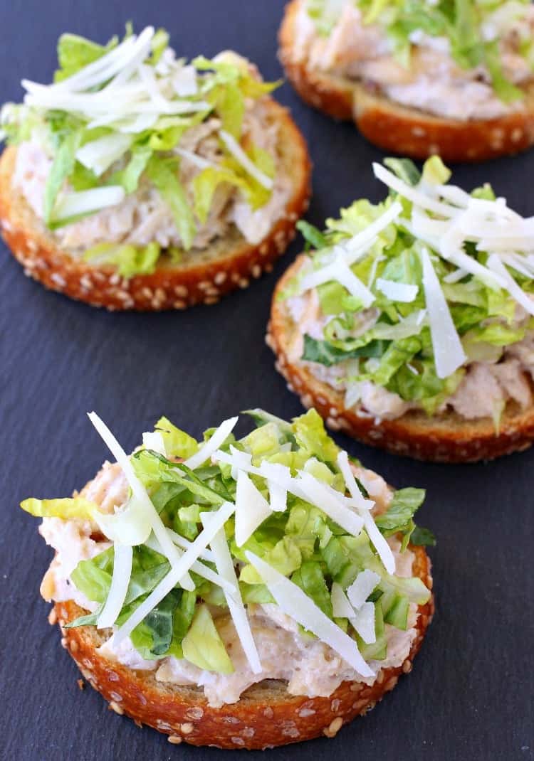 This Chicken Caesar Bruschetta is perfect for appetizers, snacks, or even a light dinner! This chicken salad is so delicious, even on it's own! Caesar Chicken Salad Bruschetta is an easy chicken recipe that can be served for appetizers or a light meal