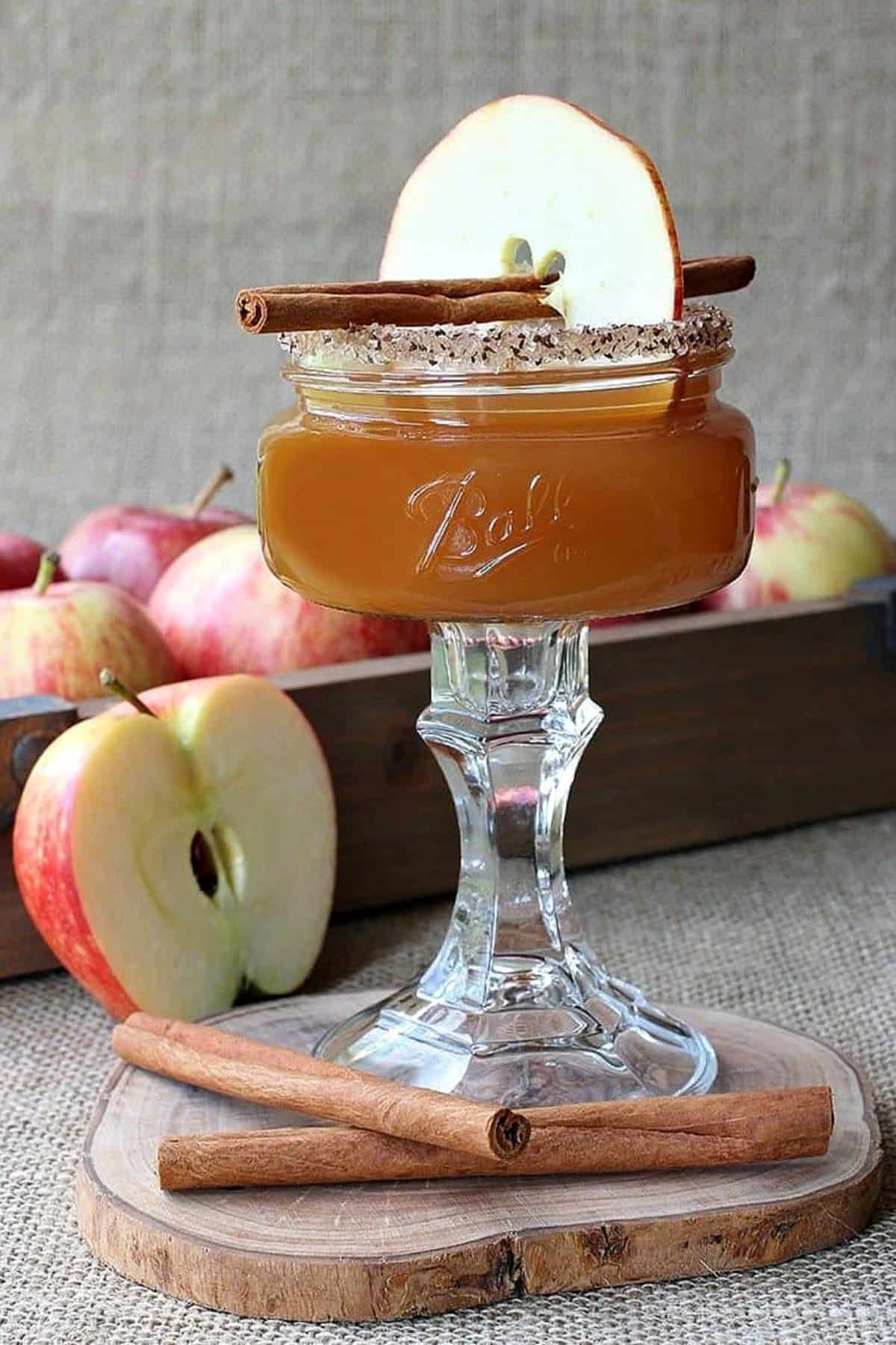 apple cider martini with sugared rim and apple garnish