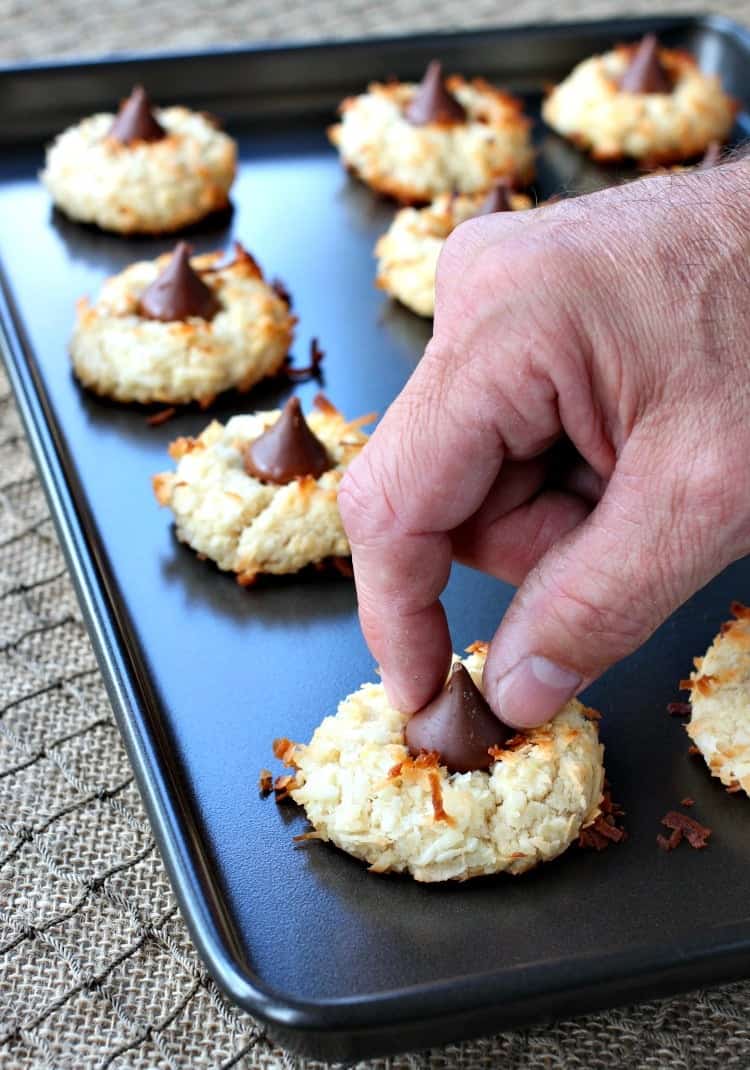 These Coconut Rum Cookies get topped with a piece of chocolate while still warm