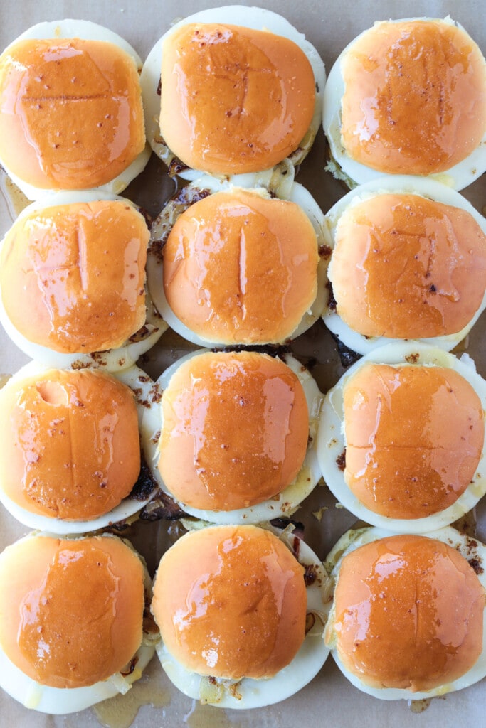 sliders on a baking sheet brushed with butter