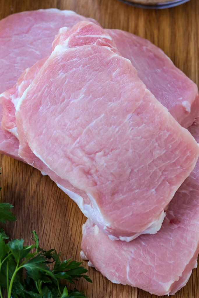 Thai Pork Kabobs have the most delicious sweet and nutty flavor! Wrap in lettuce for easy removal from the skewers and serve with rice! boneless pork chops on board