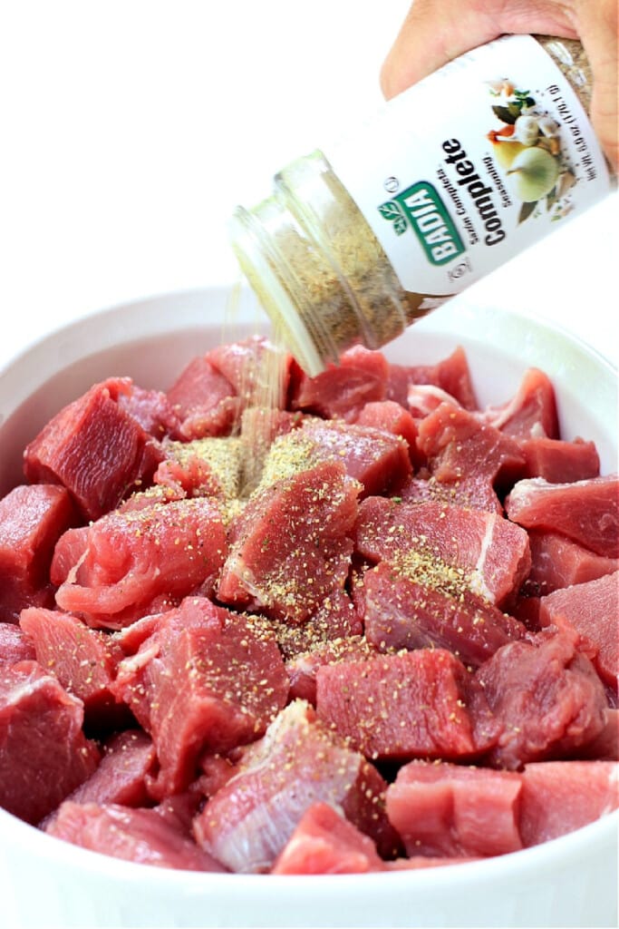 Thai Pork Kabobs have the most delicious sweet and nutty flavor! Wrap in lettuce for easy removal from the skewers and serve with rice! diced pork being seasoned in a bowl