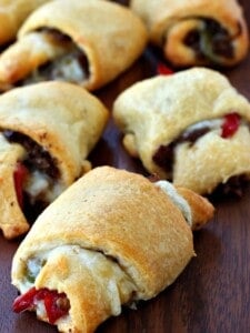 Philly Cheesesteak Crescent Rolls on a wood board