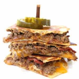 cheeseburger quesadillas cut and stacked on a plate