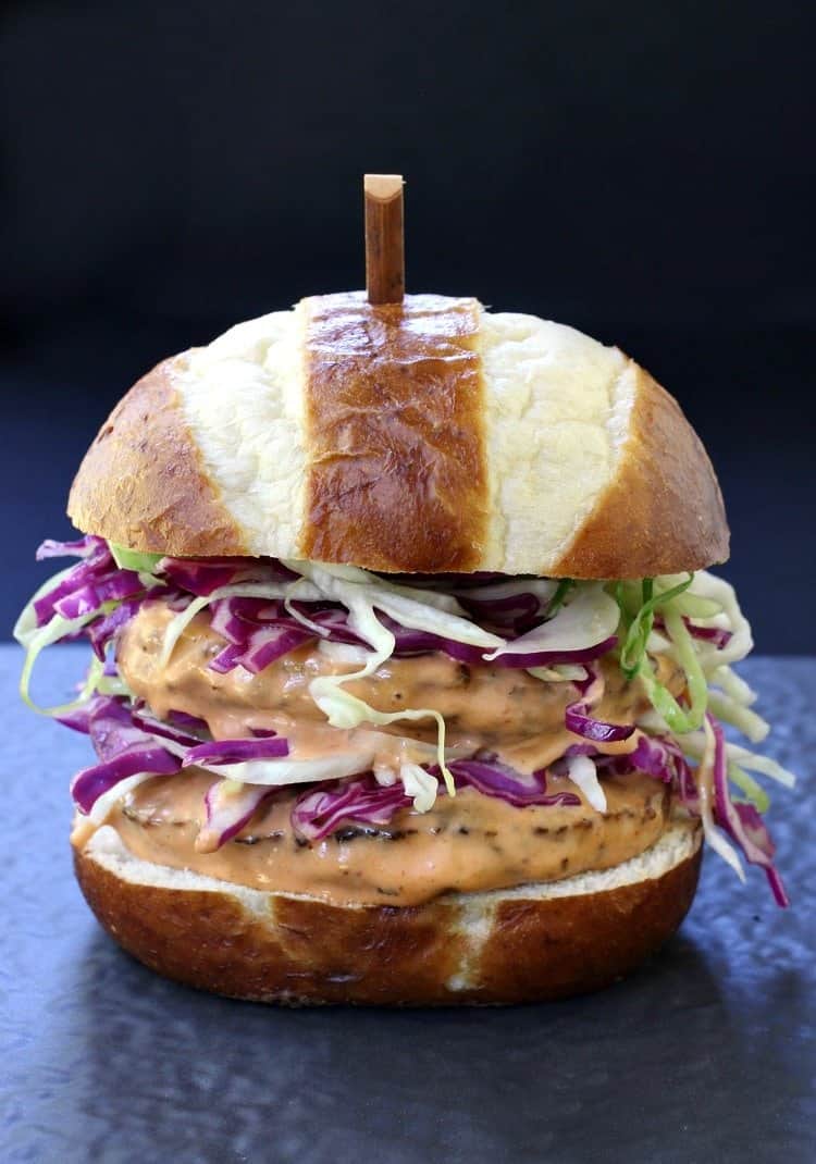 Grab the napkins for this crazy tasty Bang Bang Burger! This pork burger is actually dipped into Bang Bang Sauce before adding to a bun! BBQ Bang Bang Burger is a hamburger recipe that is coated in bang bang sauce