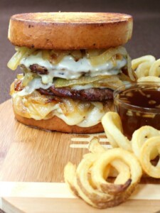 cheeseburger with caramelized onions and fries