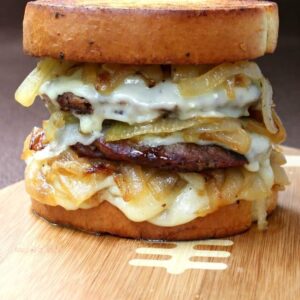 cheeseburger on Texas toast with onions