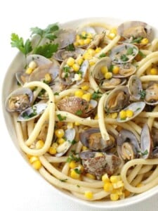 pasta recipe with fresh corn and clams in a bowl