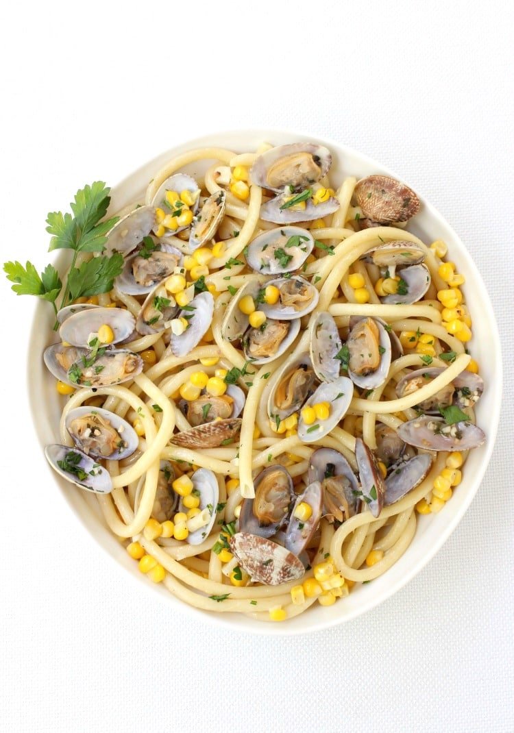 pasta with fresh corn and clams in a bowl