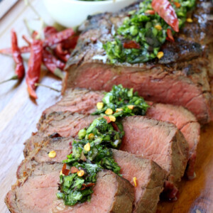 sliced steak with chimichurri sauce