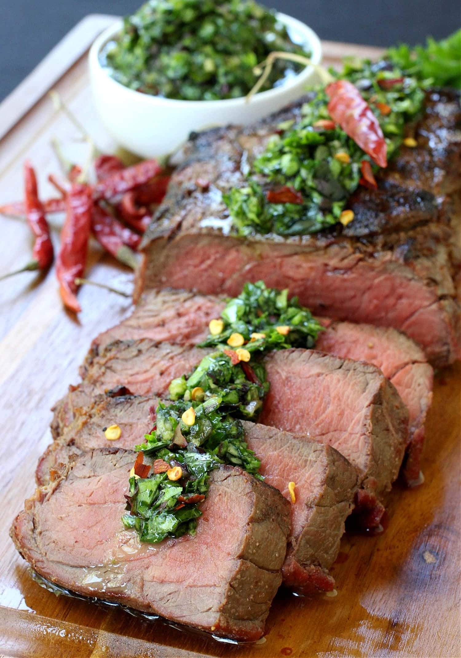 sliced steak with chimichurri sauce