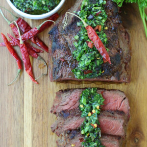 kale chimichurri sauce spooned over sliced steak