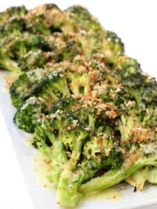 roasted broccoli with breadcrumbs and Hollandaise sauce on a platter
