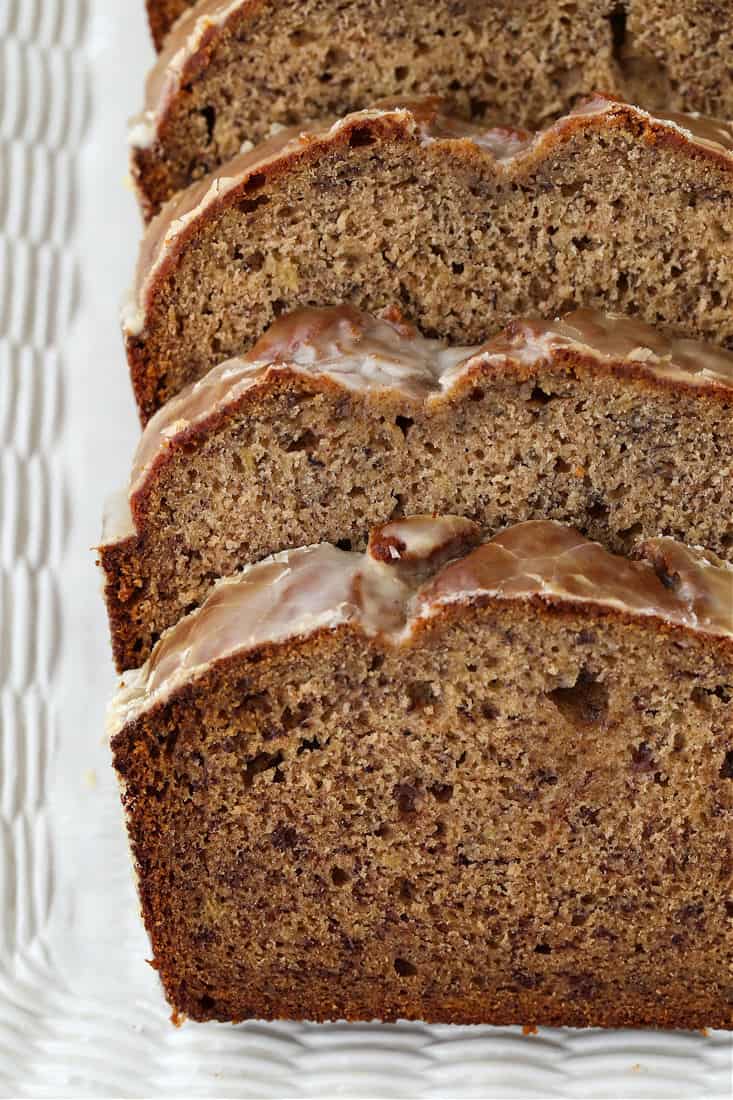 Sliced banana bread on yellow plate