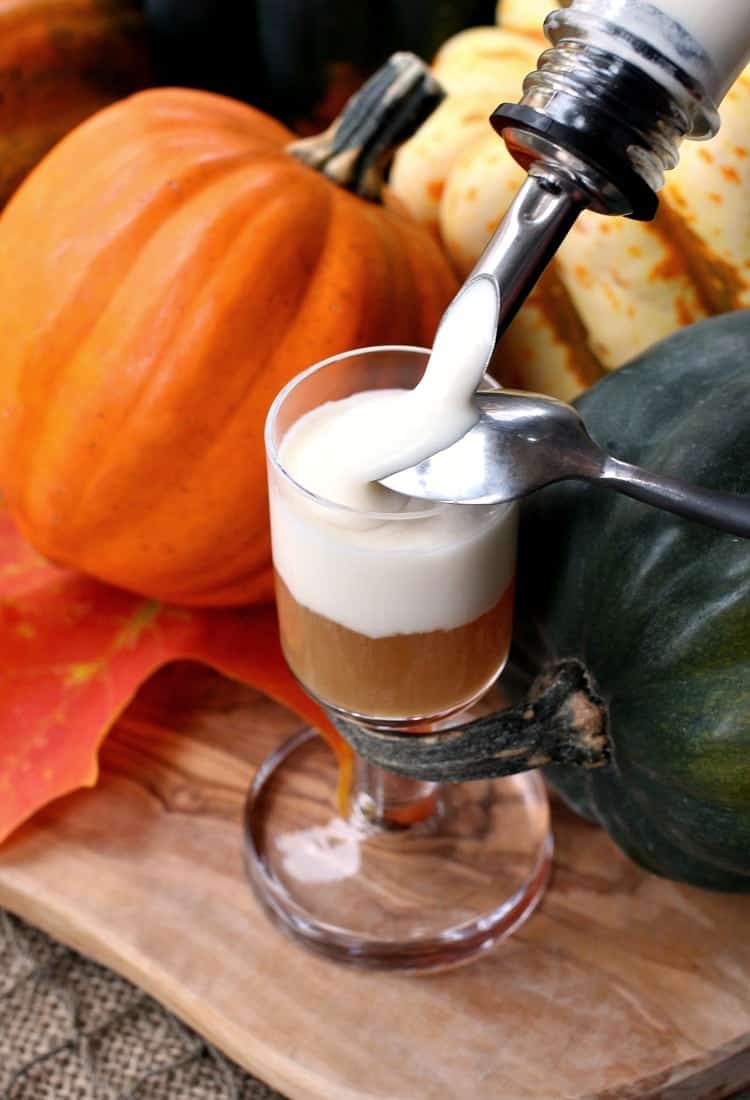 These Jack-O-Blast Pumpkin Rum Shooters get a layer of whipped boozy cream on top!