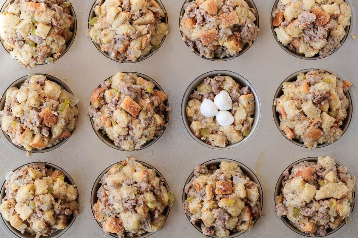 stuffing in muffin tins with mozzarella cheese inside