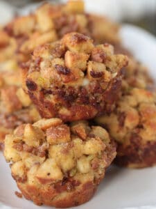 muffins made of sausage stuffing stacked on a plate