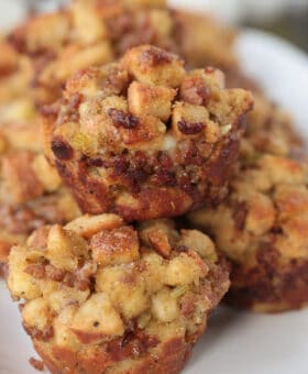 muffins made of sausage stuffing stacked on a plate