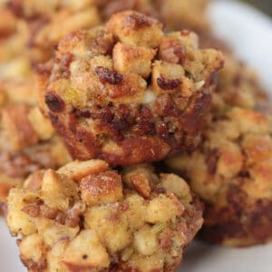muffins made of sausage stuffing stacked on a plate