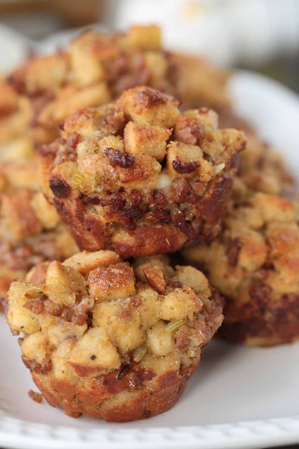 muffins made of sausage stuffing stacked on a plate