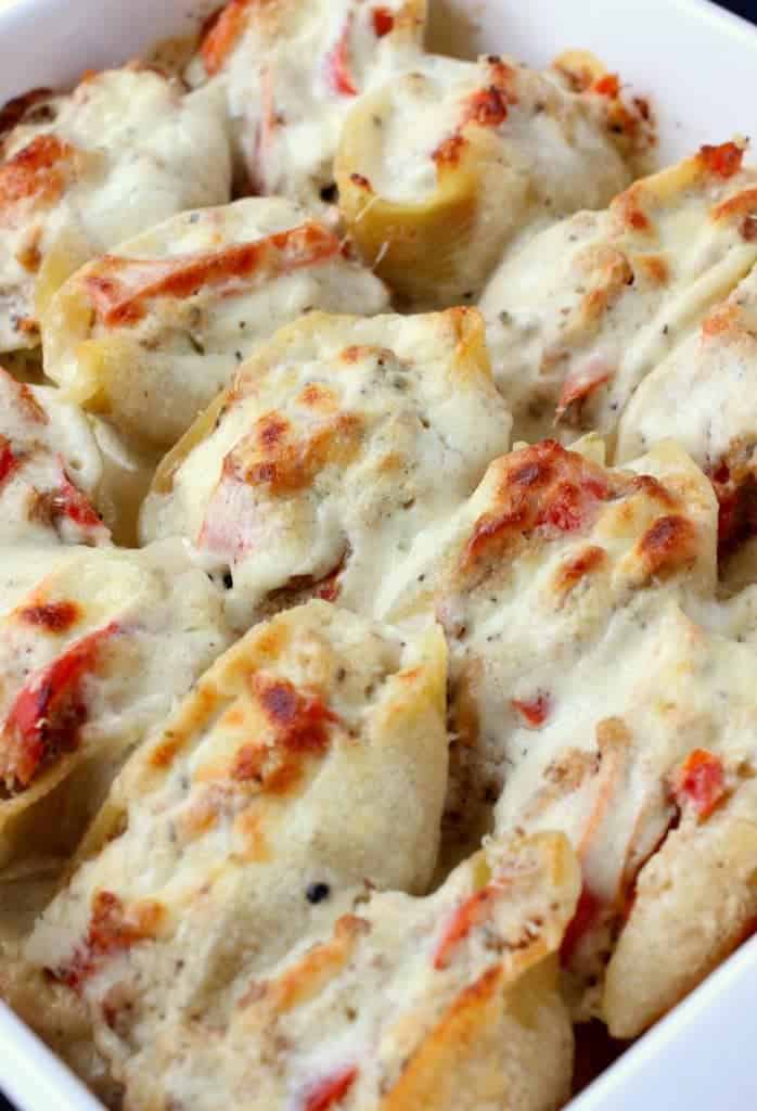 Philly Cheesesteak Stuffed Shells recipe are covered with a homemade alfredo sauce and baked