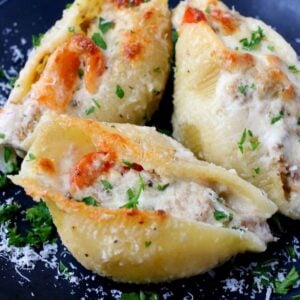 Philly Cheesesteak Stuffed Shells are filled with a cheesy, creamy beef and pepper filling then covered in alfredo sauce!