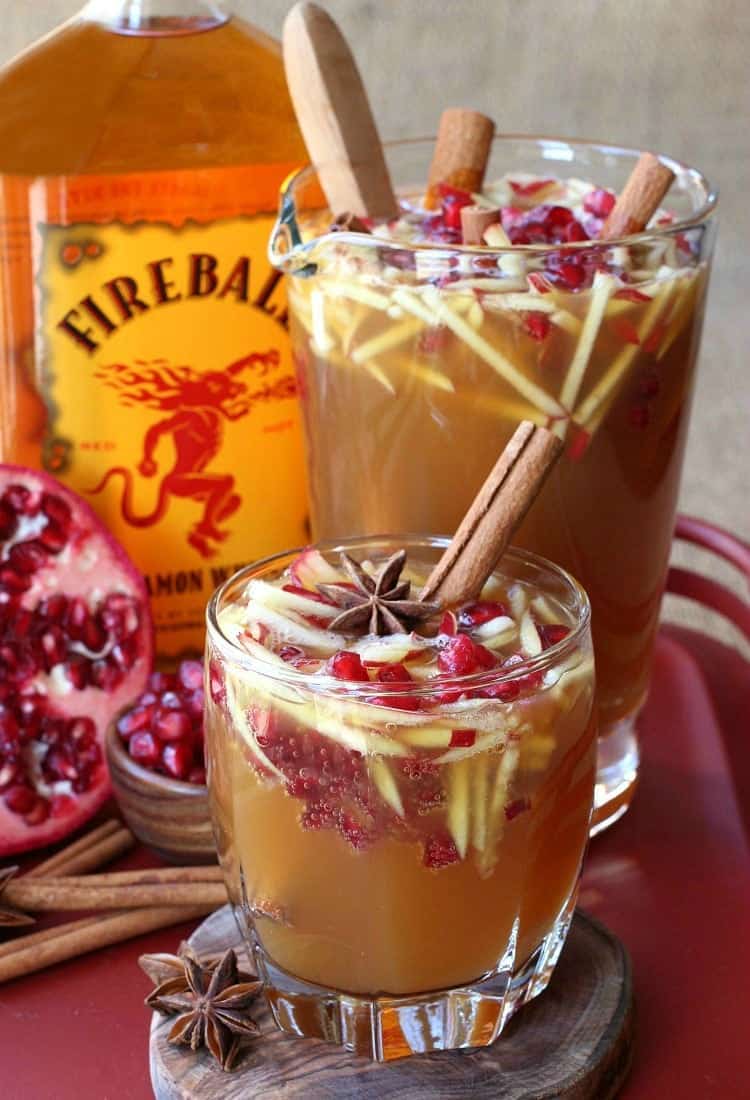 Sparkling Apple Cider Sangria is our favorite fall sangria recipe! Crisp apple cider with a cinnamon kick from Fireball, topped with prosecco! Sparkling Fireball Sangria will warm you up on cold nights!